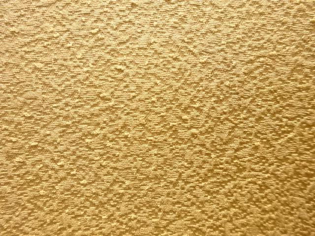  のり散らし模様織り出し一つ紋色無地着物